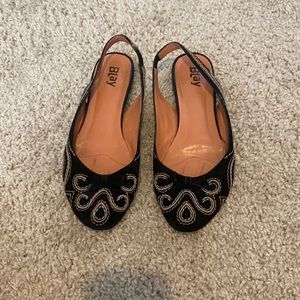 Black flat sling backs